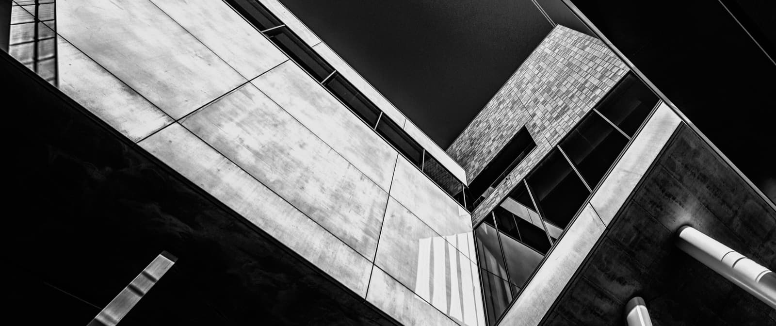 Diagonal steel beams against the sky